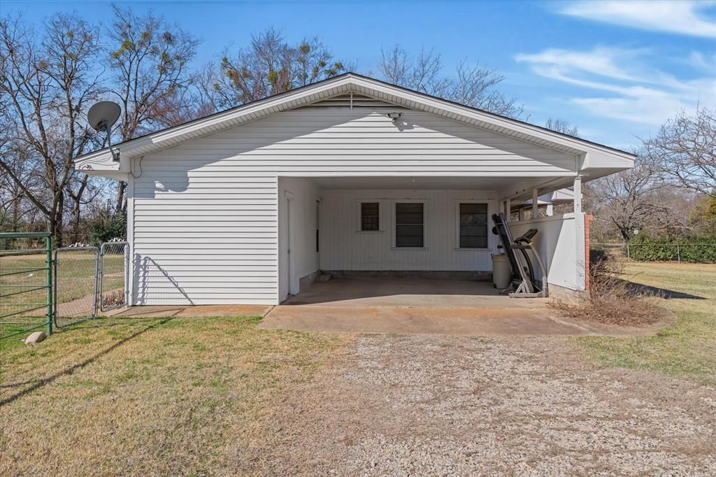 1910 Goodnight Boulevard Wills Point, TX 75169 - Photo 36 of 37 a front view of a house with large trees