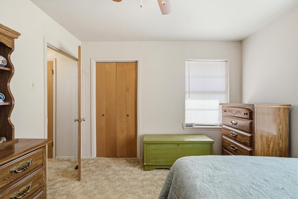1910 Goodnight Boulevard Wills Point, TX 75169 - Photo 7 of 37 a bedroom with a bed and a dresser