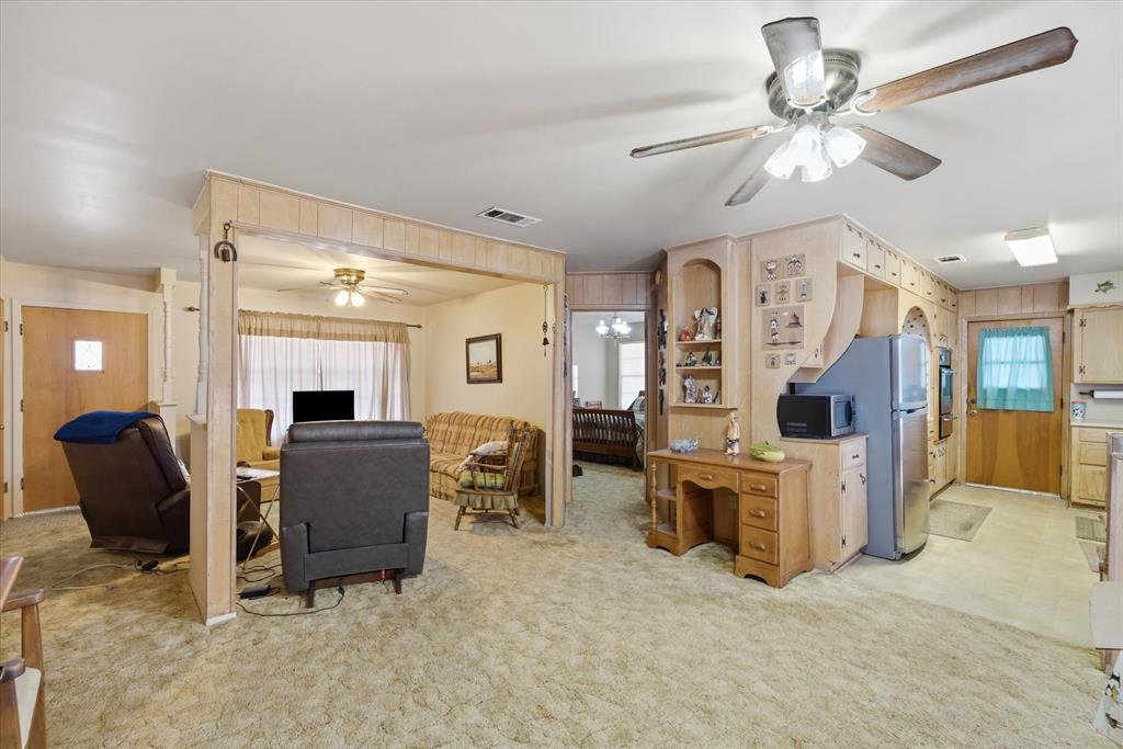 1910 Goodnight Boulevard Wills Point, TX 75169 - Photo 8 of 37 a living room with furniture and a flat screen tv