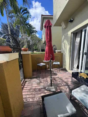 a view of a house with furniture and a mirror
