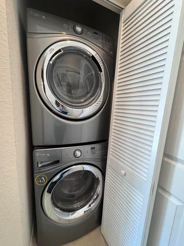 a living room with furniture and stairs