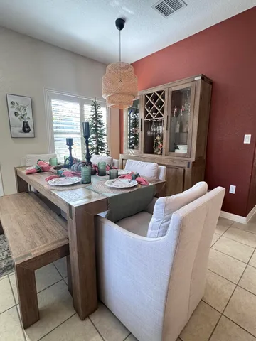a living room with stainless steel appliances kitchen island granite countertop furniture and a fireplace