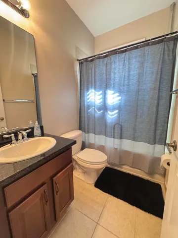 a bedroom with bed and window