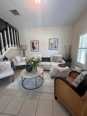 a living room with furniture and window