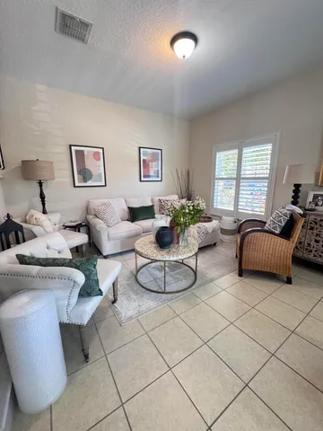 a living room with furniture and a window