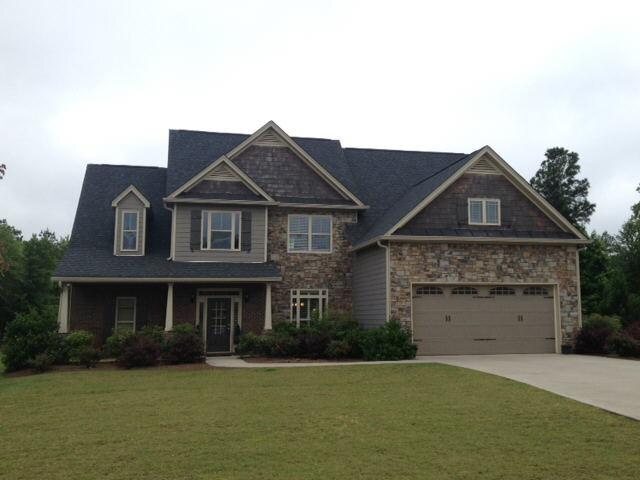 7 Outpost Southeast Rome, GA 30161 - Photo 1 of 1 a front view of a house with a garden