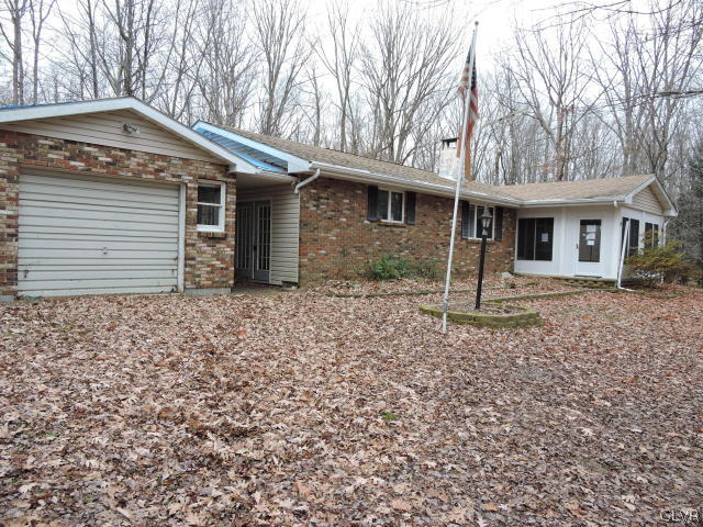 191 Hobby Acres Road Kunkletown, PA 18058 - Photo 1 of 15 a front view of a house with garden