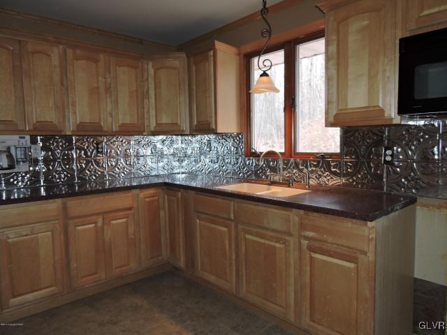 191 Hobby Acres Road Kunkletown, PA 18058 - Photo 6 of 15 a kitchen with stainless steel appliances white cabinets and a sink