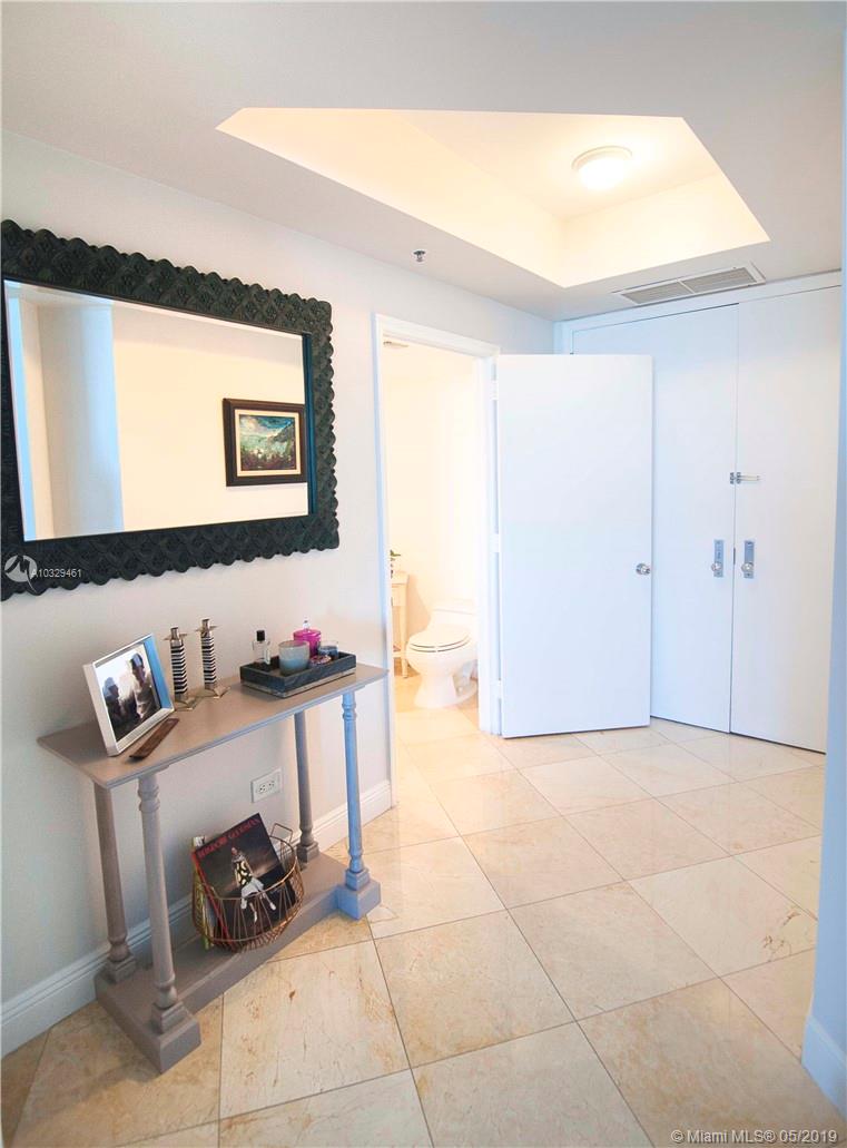 808 Brickell Key Drive, Unit 802 Miami, FL 33131 - Photo 13 of 48 A great foyer area with a half bath as you enter the unit through double doors.