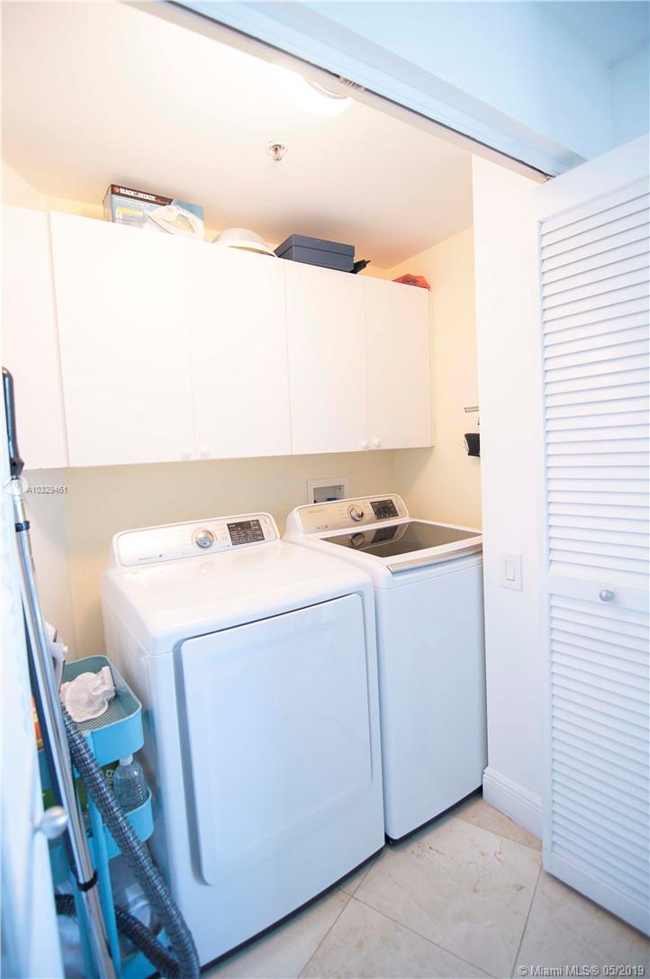 808 Brickell Key Drive, Unit 802 Miami, FL 33131 - Photo 14 of 48 A large laundry room with newer appliances.