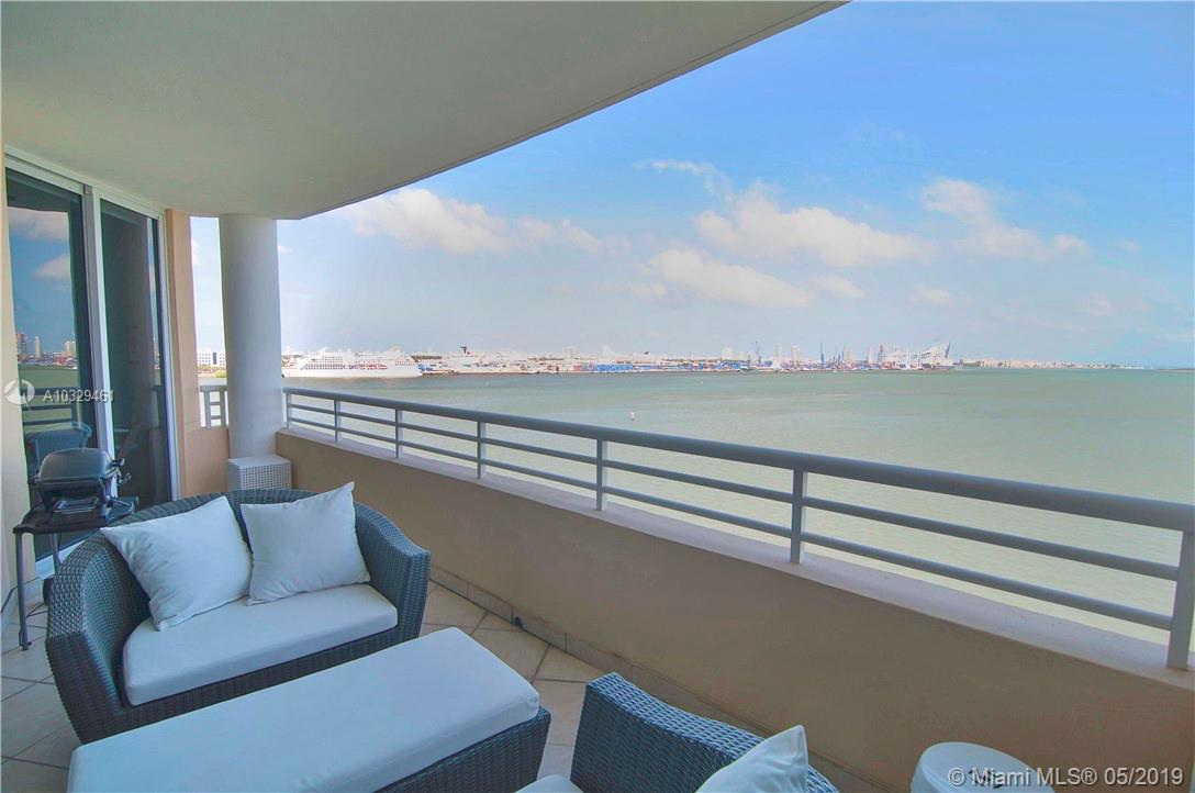 808 Brickell Key Drive, Unit 802 Miami, FL 33131 - Photo 16 of 48 Stunning bay views from an expansive balcony with access from the master bedroom, living area, and kitchen.