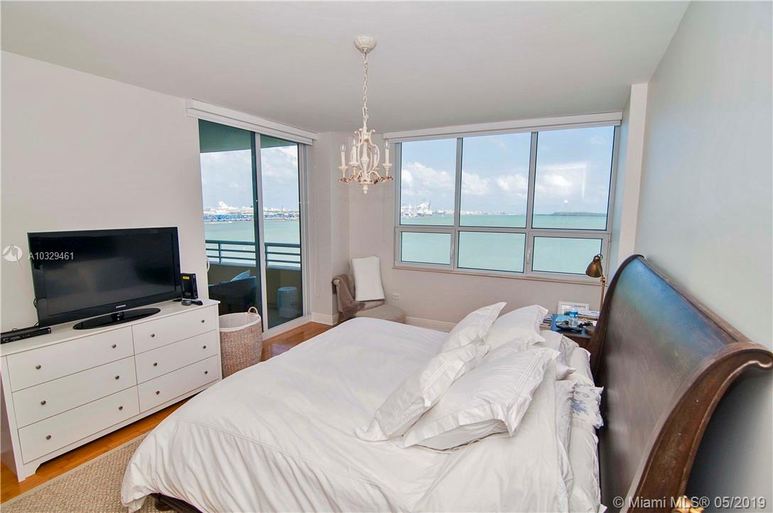 808 Brickell Key Drive, Unit 802 Miami, FL 33131 - Photo 5 of 48 Enjoy amazing views, hard wood floors, and balcony access from the master suite.