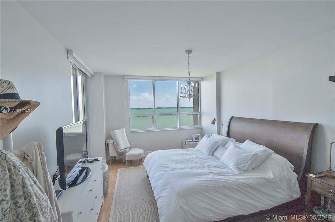 808 Brickell Key Drive, Unit 802 Miami, FL 33131 - Photo 6 of 48 Enjoy amazing views, hard wood floors, and balcony access from the master suite.
