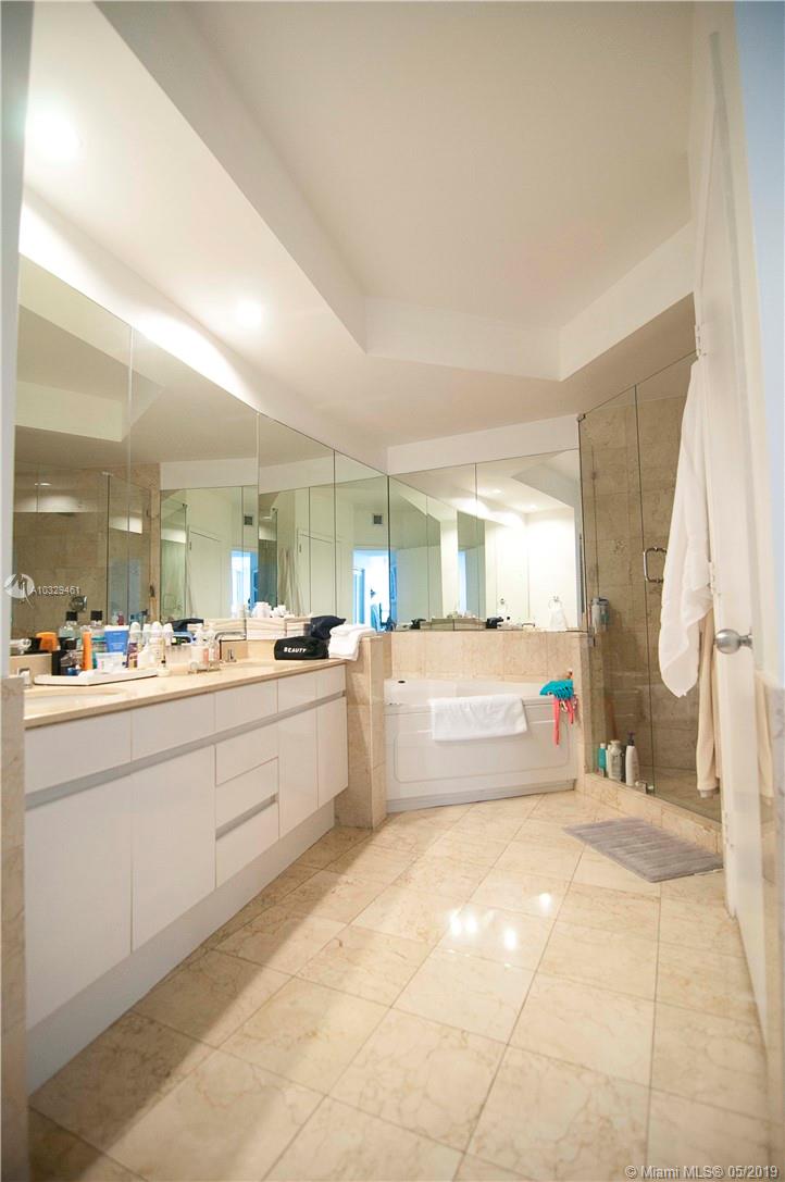 808 Brickell Key Drive, Unit 802 Miami, FL 33131 - Photo 7 of 48 A very large master bedroom with double vanity, two linen closets, Jacuzzi tub, updated shower, and a separate room with bidet/toilet.