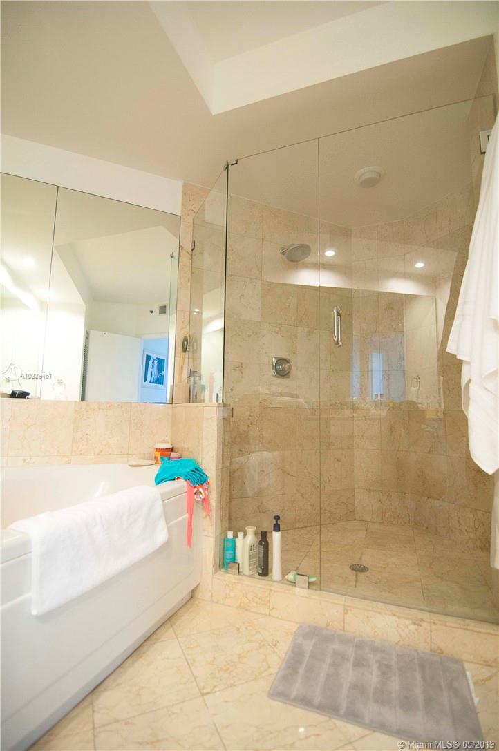 808 Brickell Key Drive, Unit 802 Miami, FL 33131 - Photo 8 of 48 A very large master bedroom with double vanity, two linen closets, Jacuzzi tub, updated shower, and a separate room with bidet/toilet.
