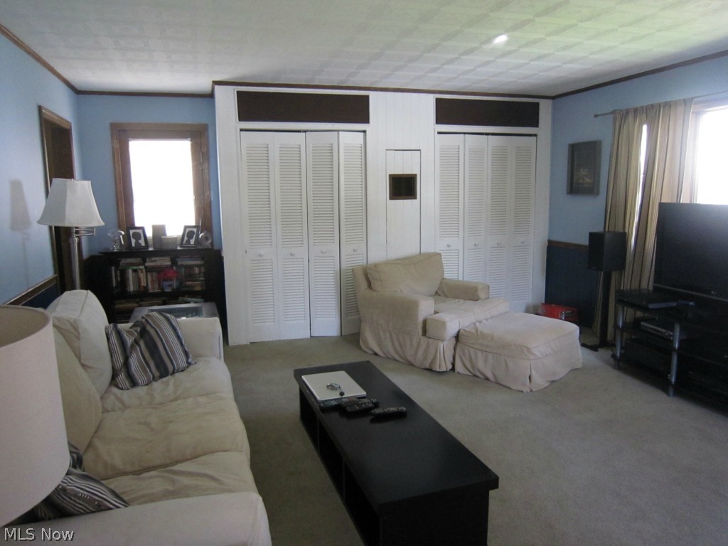 4877 Arbor Road Southwest Canton, OH 44710 - Photo 10 of 18 Family room has two double closets perfect for holding games, photo albums, etc. and will definitely be the families hang out spot.
