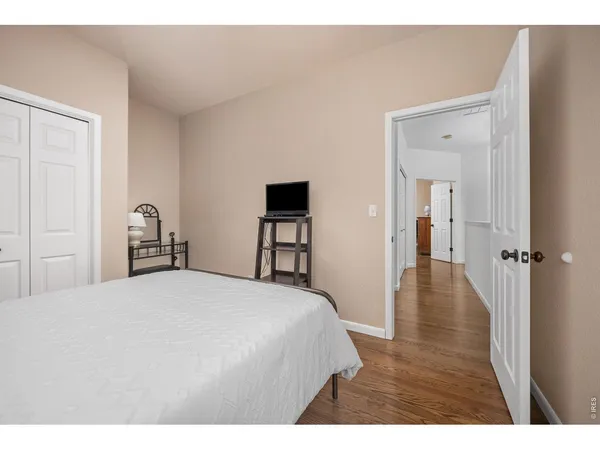 a bedroom with a bed and a table