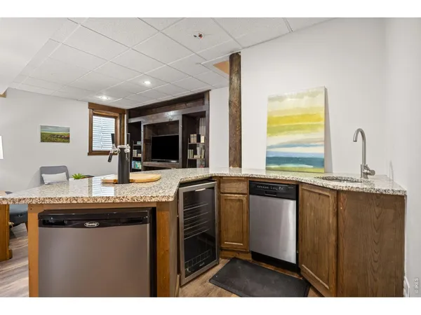 a kitchen with granite countertop a sink and a stove