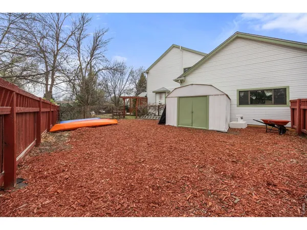 a view of a backyard of the house