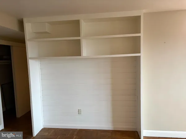 a bathroom with a sink a toilet a mirror and shower curtain