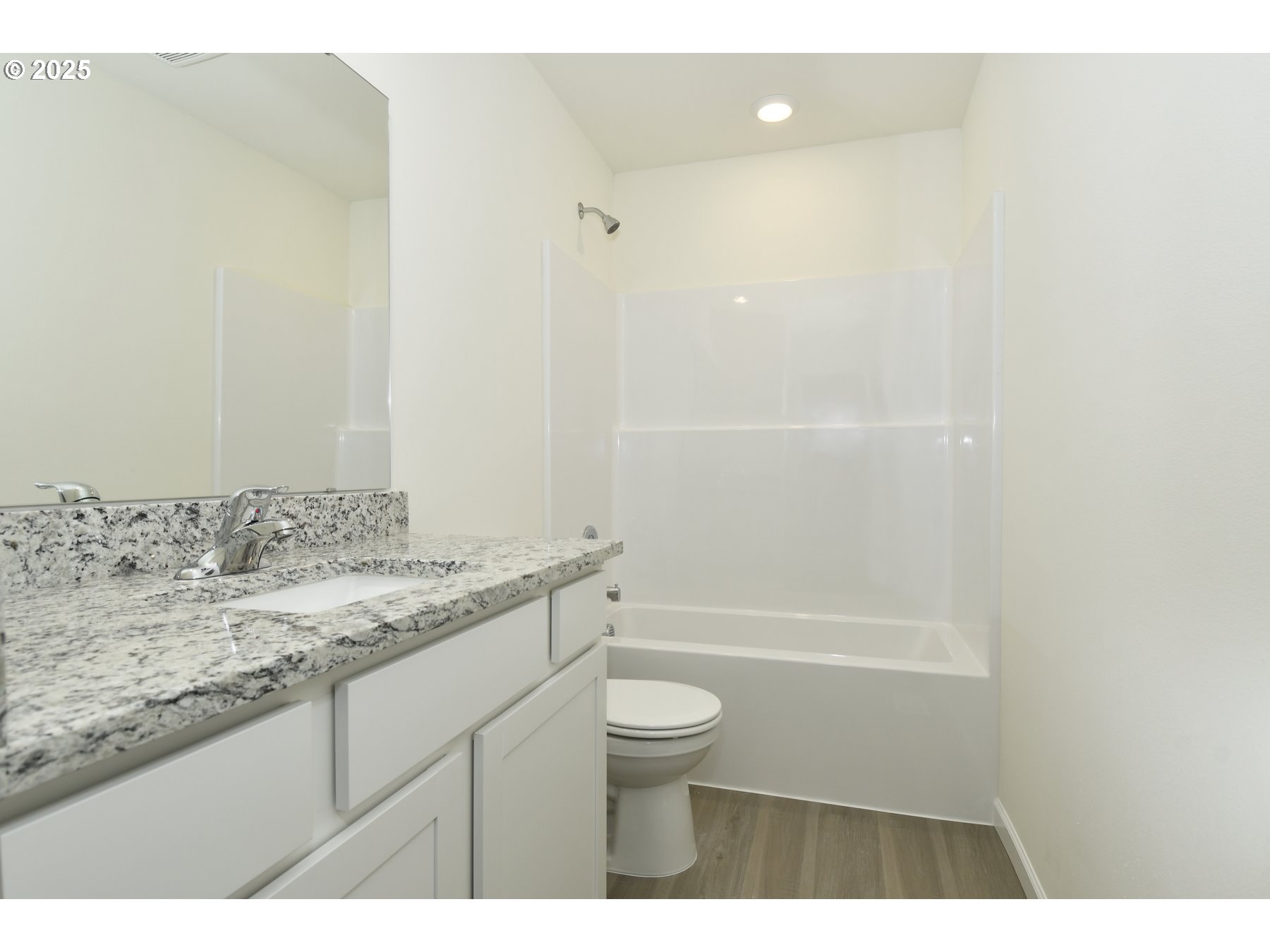 3905 Southwest Duniway Lane Gresham, OR 97080 - Photo 19 of 20 a bathroom with a granite countertop sink a toilet and shower