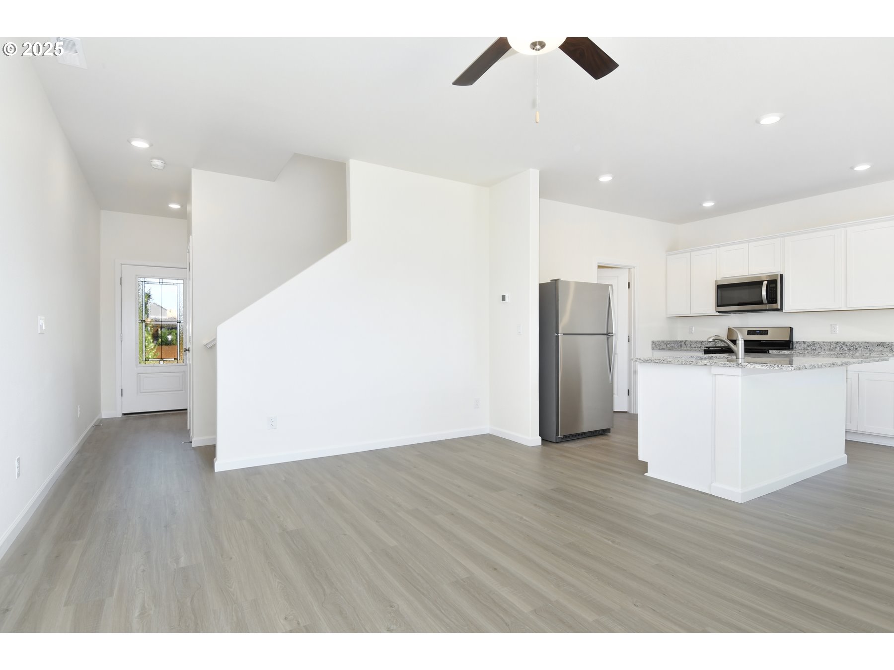 3905 Southwest Duniway Lane Gresham, OR 97080 - Photo 5 of 20 a view of kitchen with stainless steel appliances refrigerator stove microwave and cabinets