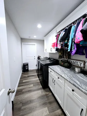 a kitchen with stainless steel appliances granite countertop a sink and cabinets