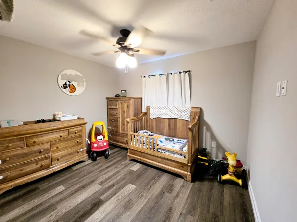 a bed room with furniture and a window