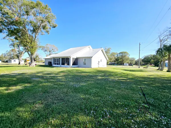 a view of a house with a big yard