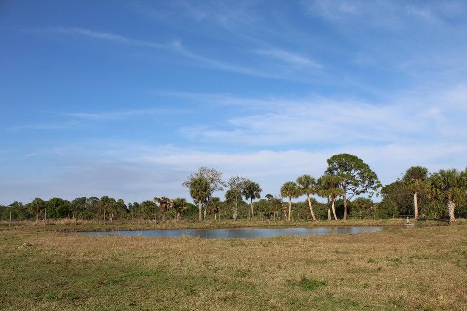 2410 South Brocksmith Road Fort Pierce, FL 34945 - Photo 35 of 65 a view of a lake with a big yard
