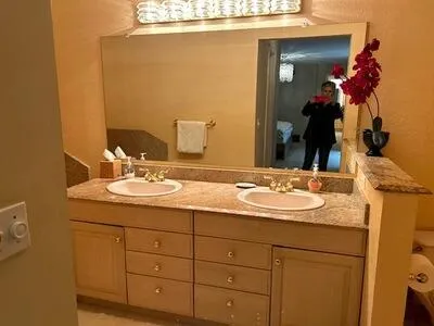 a bathroom with a sink and a mirror
