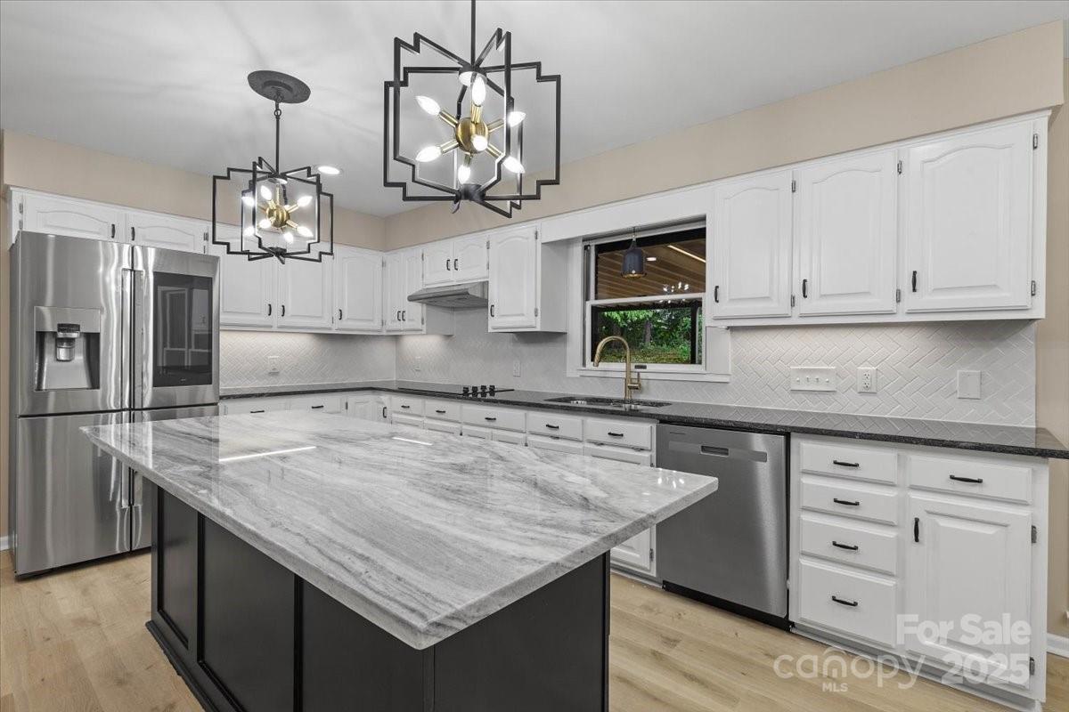 5916 Cashion Road Huntersville, NC 28078 - Photo 11 of 45 a kitchen with cabinets appliances and a counter space