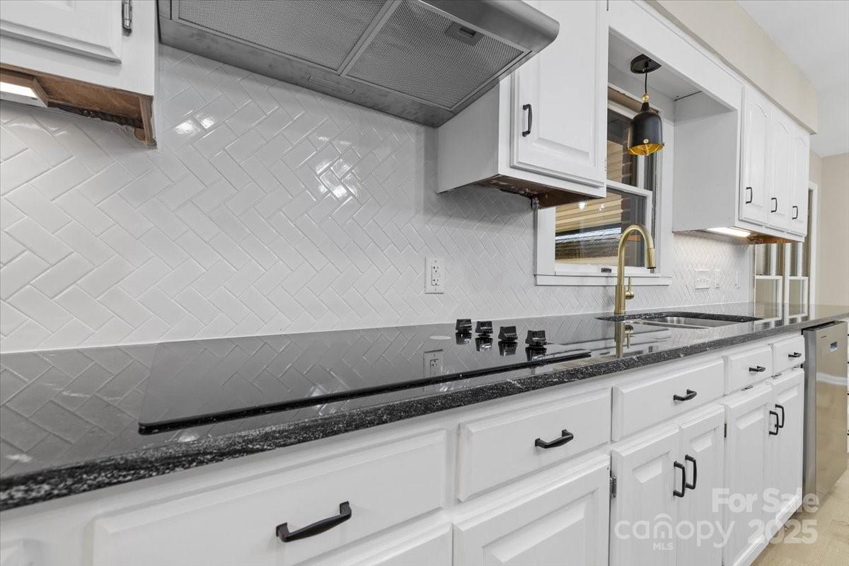 5916 Cashion Road Huntersville, NC 28078 - Photo 15 of 45 a kitchen with granite countertop a sink and cabinets