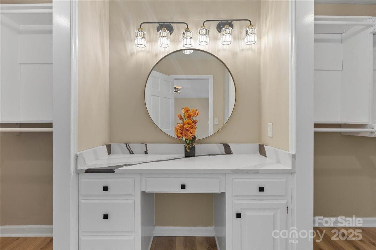 5916 Cashion Road Huntersville, NC 28078 - Photo 24 of 45 a bathroom with a sink and a mirror