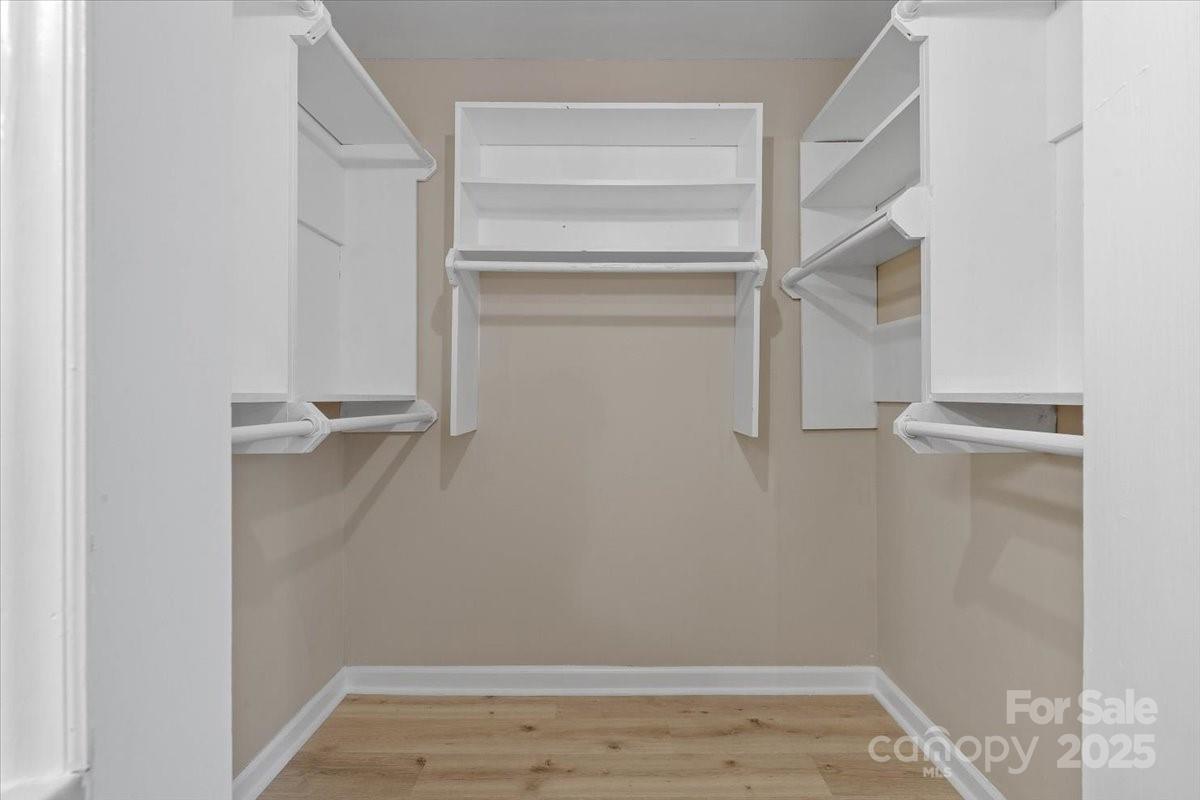 5916 Cashion Road Huntersville, NC 28078 - Photo 25 of 45 a view of walk in closet with empty racks