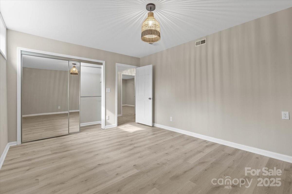 5916 Cashion Road Huntersville, NC 28078 - Photo 31 of 45 wooden floor in an empty room with a window