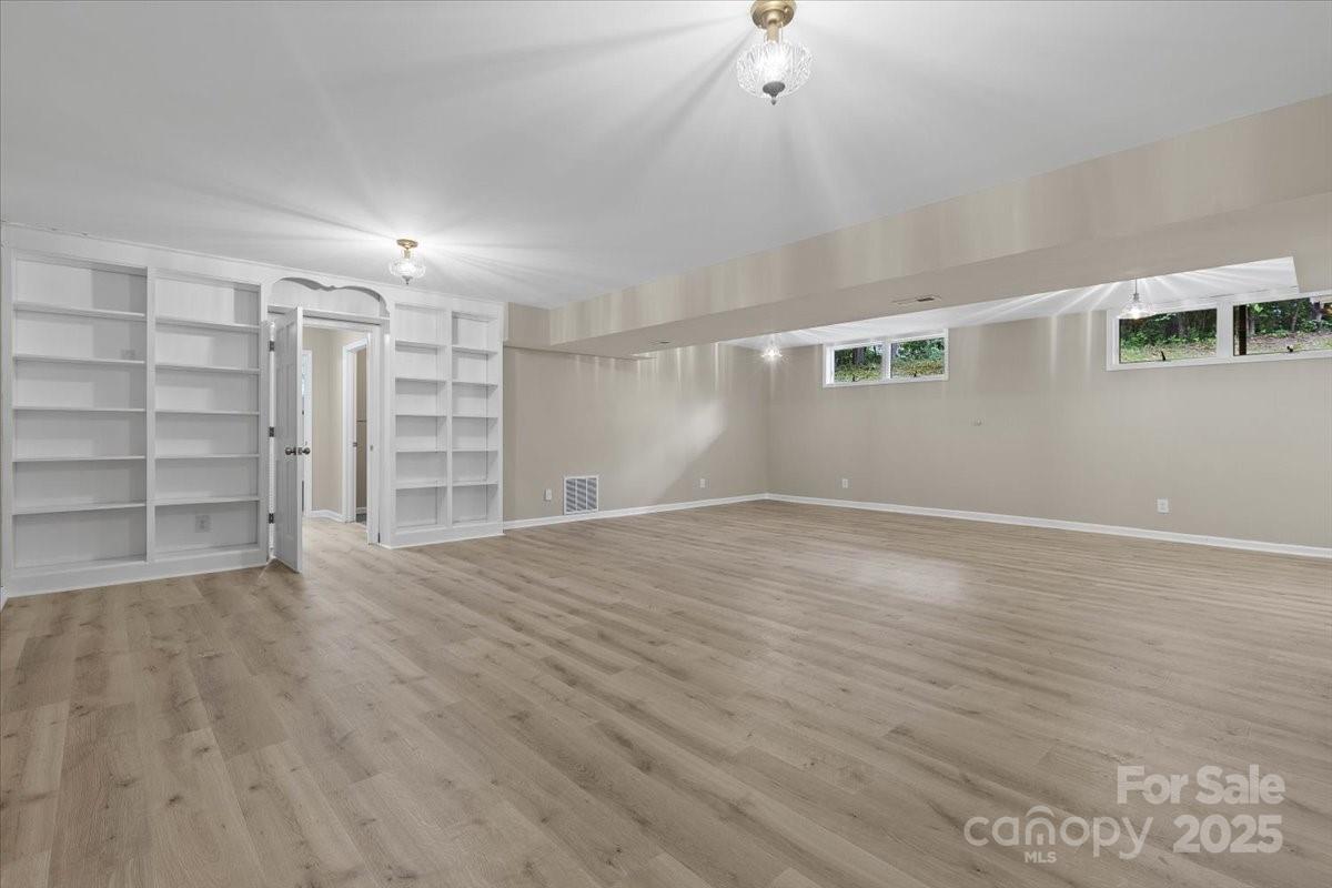 5916 Cashion Road Huntersville, NC 28078 - Photo 36 of 45 a view of empty room with wooden floor and fan