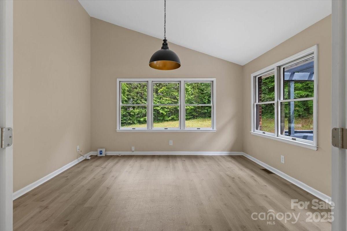 5916 Cashion Road Huntersville, NC 28078 - Photo 8 of 45 an empty room with wooden floor and windows