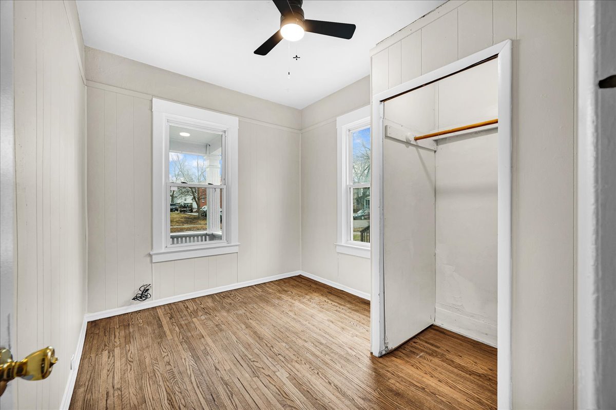 1018 North Prairie Street Bloomington, IL 61701 - Photo 11 of 49 a view of an empty room with wooden floor and a window