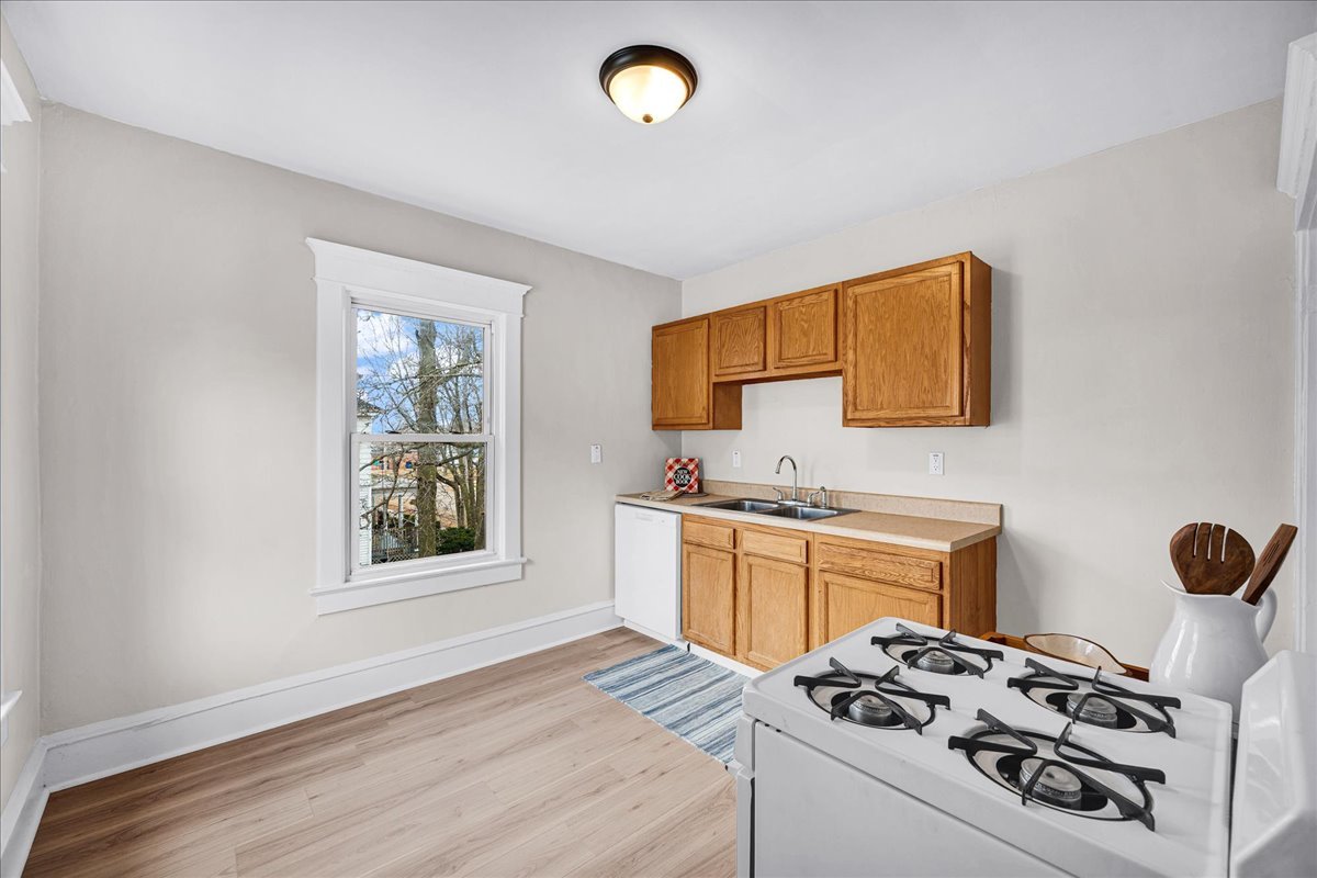 1018 North Prairie Street Bloomington, IL 61701 - Photo 16 of 49 a kitchen with stainless steel appliances a stove a sink and a refrigerator