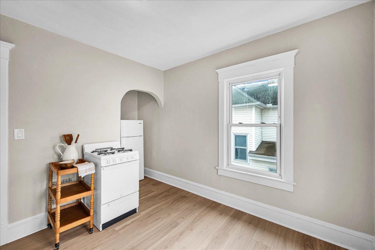 1018 North Prairie Street Bloomington, IL 61701 - Photo 18 of 49 a room with furniture a rug potted plant and a window