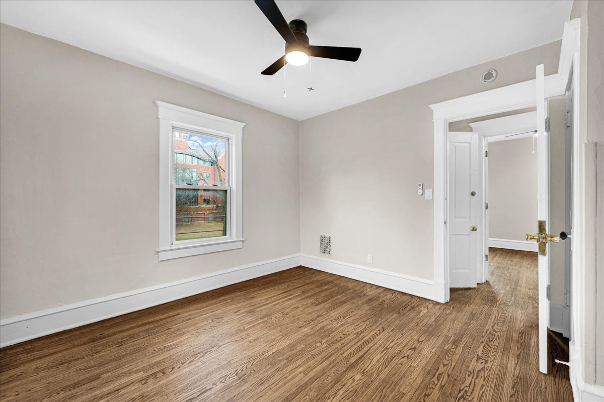 1018 North Prairie Street Bloomington, IL 61701 - Photo 20 of 49 wooden floor in an empty room with a window