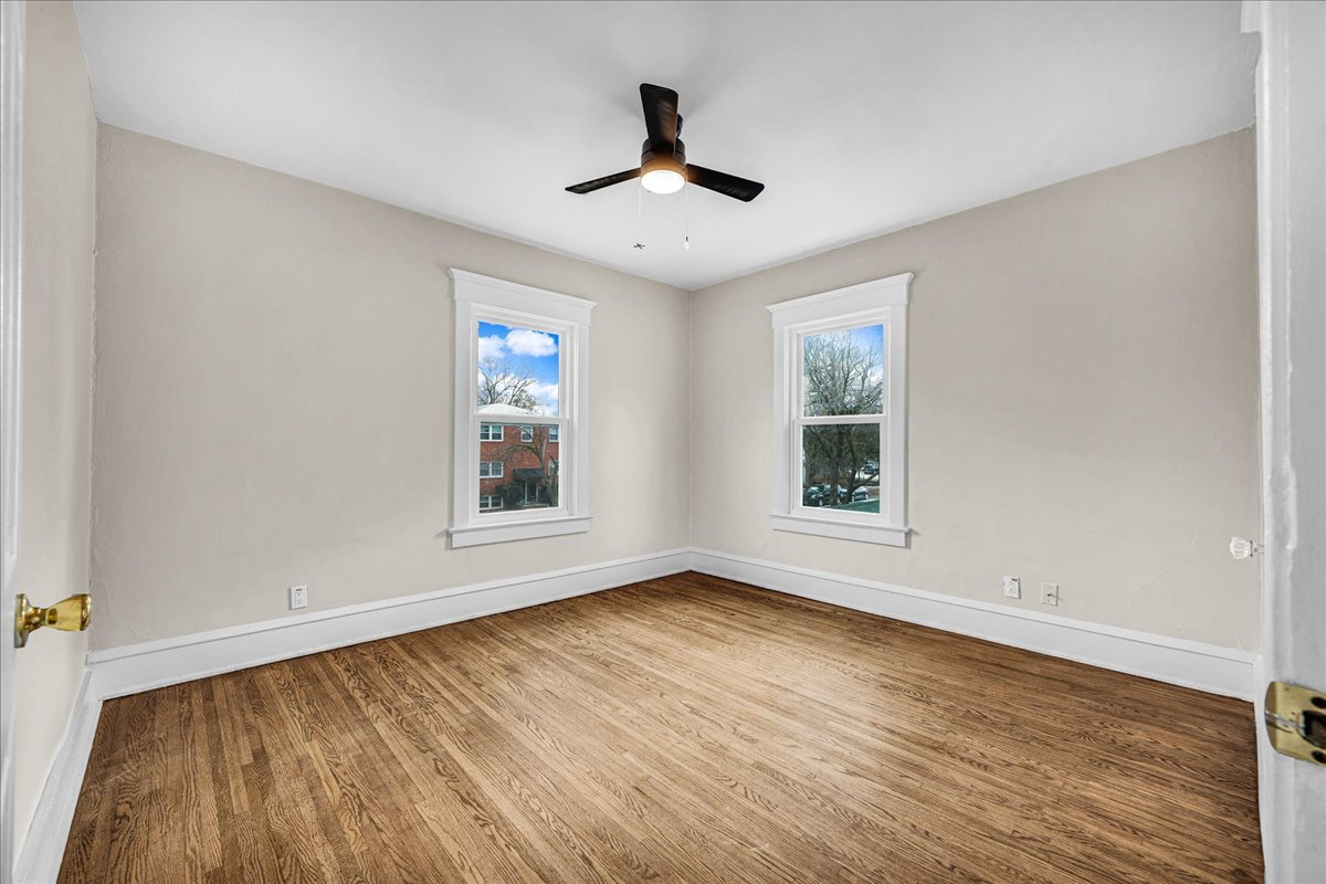 1018 North Prairie Street Bloomington, IL 61701 - Photo 24 of 49 a view of an empty room with wooden floor and a window