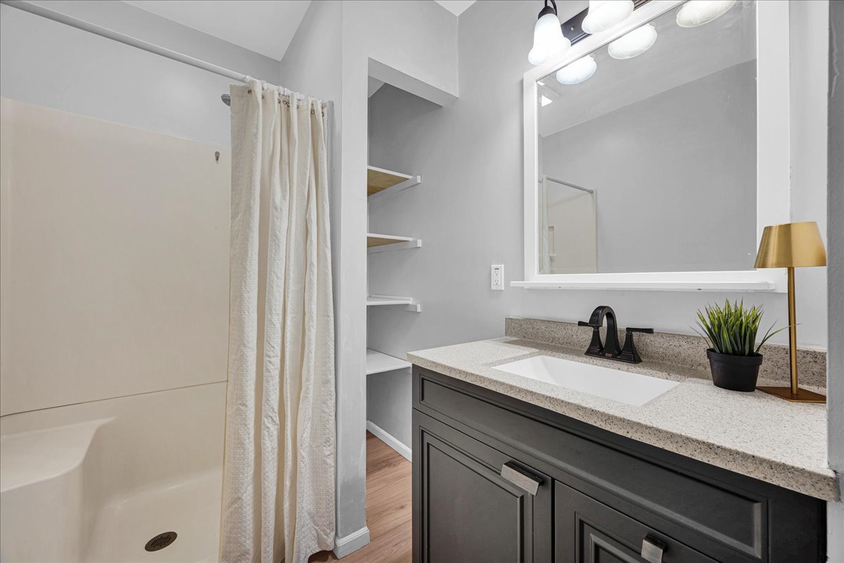 1018 North Prairie Street Bloomington, IL 61701 - Photo 26 of 49 a kitchen with a sink and a mirror