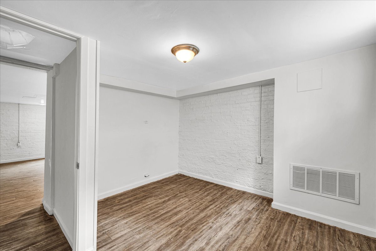 1018 North Prairie Street Bloomington, IL 61701 - Photo 28 of 49 a view of a room with wooden floor and a window