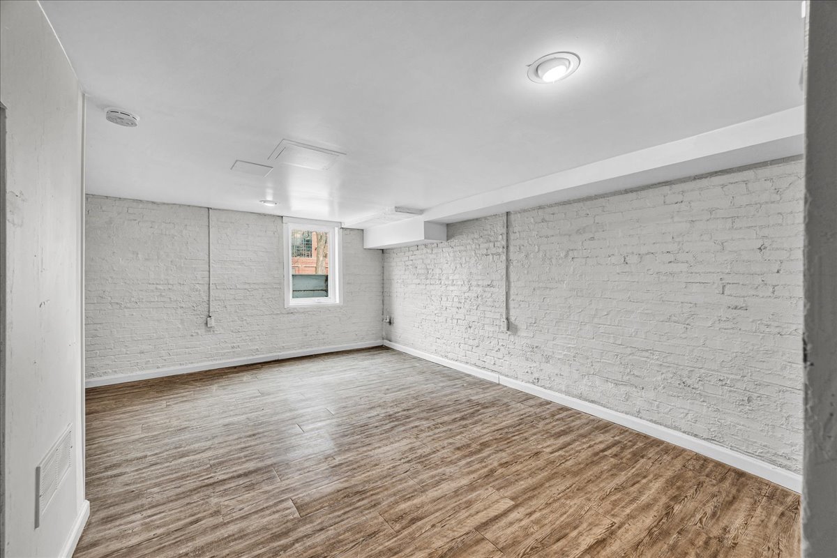 1018 North Prairie Street Bloomington, IL 61701 - Photo 29 of 49 a view of an empty room with wooden floor