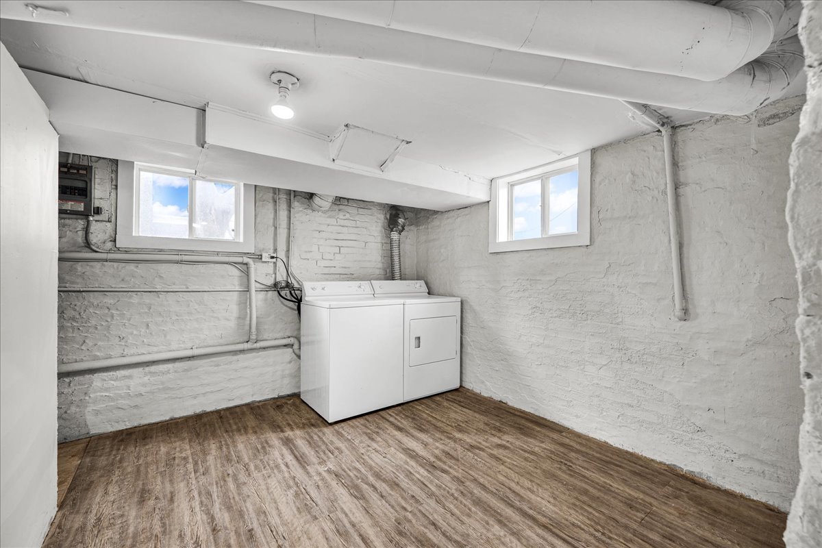 1018 North Prairie Street Bloomington, IL 61701 - Photo 31 of 49 a view of utility room with closet and wooden floors
