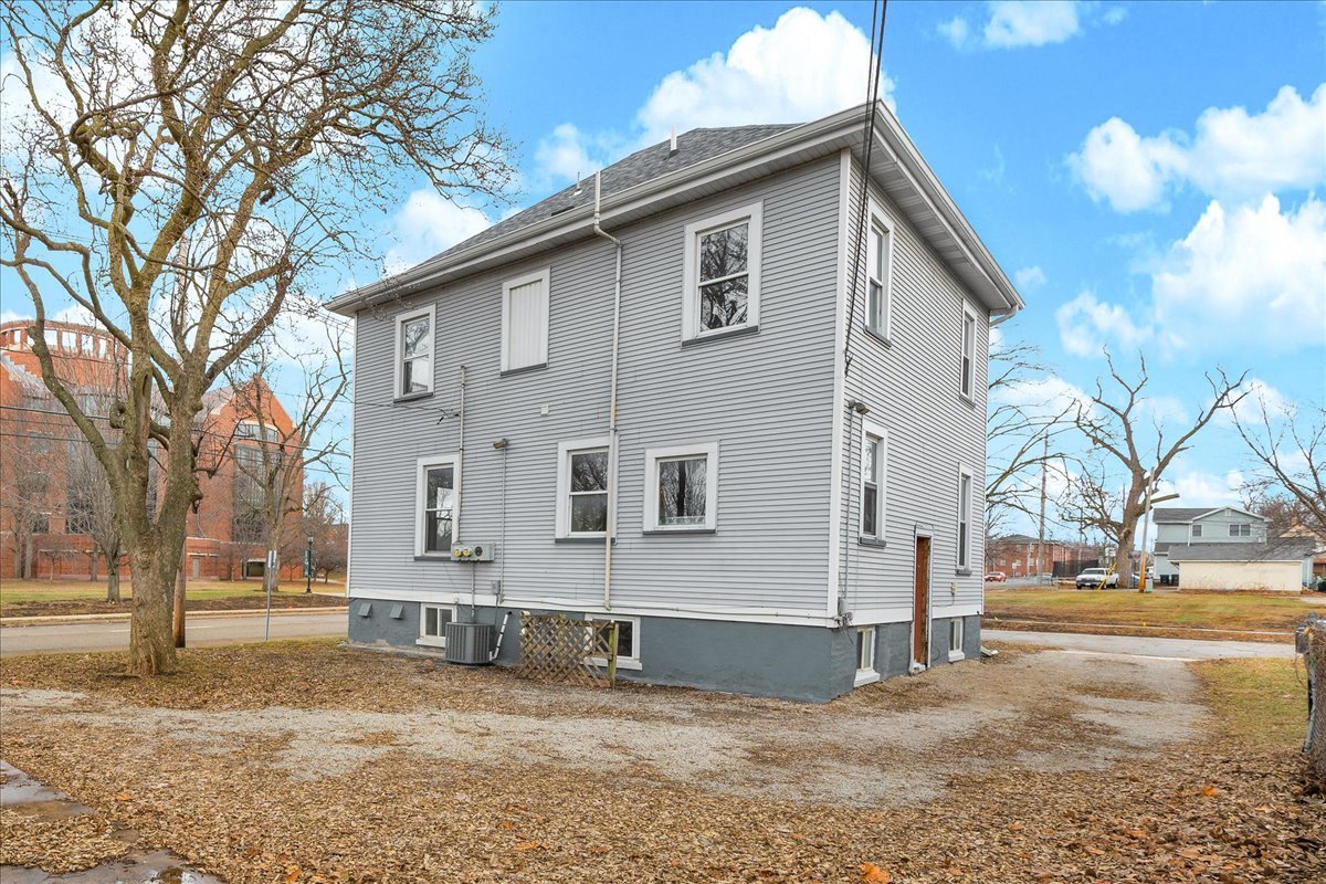 1018 North Prairie Street Bloomington, IL 61701 - Photo 37 of 49 a front view of a house with a yard and garage