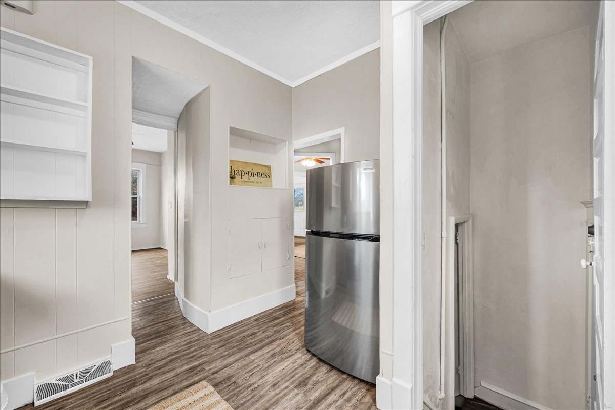 1018 North Prairie Street Bloomington, IL 61701 - Photo 6 of 49 a view of a refrigerator in kitchen and an empty room