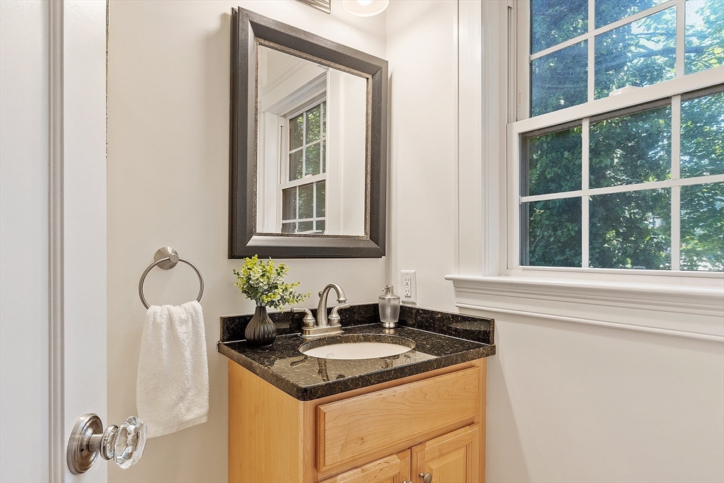 15 Marion Road Watertown, MA 02472 - Photo 16 of 41 a kitchen with granite countertop a sink and cabinets